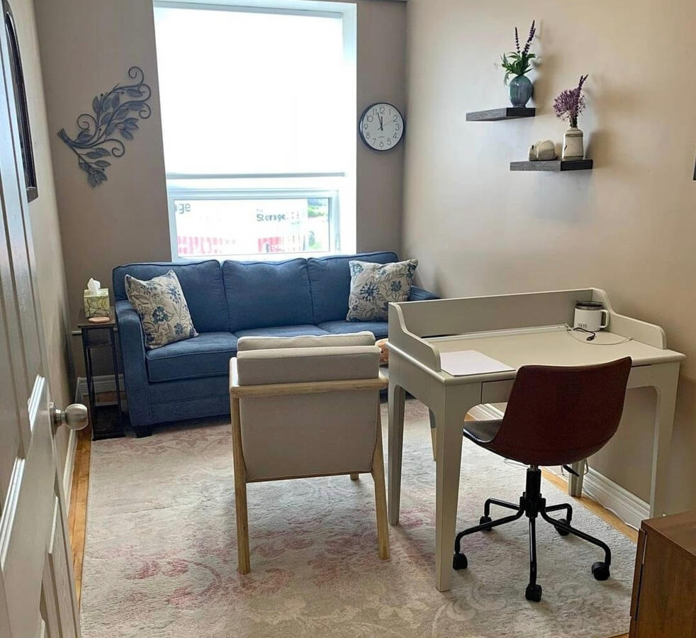 office space Therapy office with couch and armchair and natural light